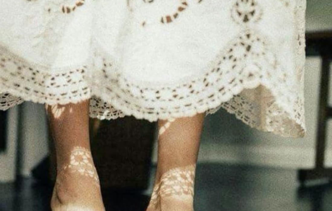 Bare feet in dappled light